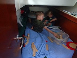 The boys are playing trains in Ethan's cabin.