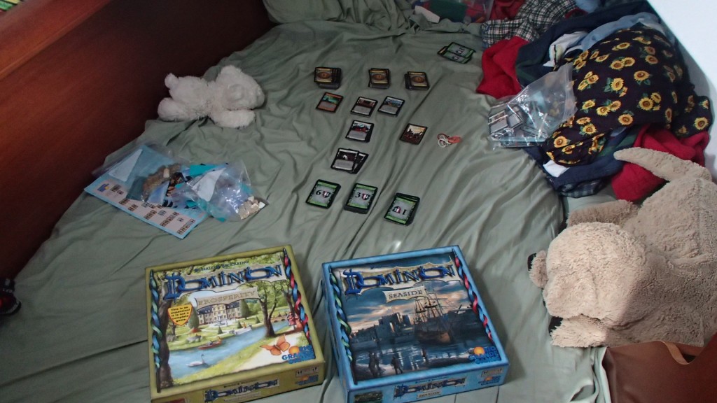 A game of Dominion all set up in the boy's bedroom.