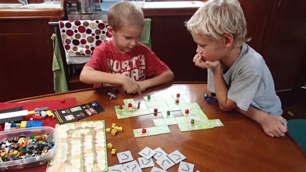 James and Matthew playing a game of Carcassonne.  They play mostly by the rules, but don't keep score.