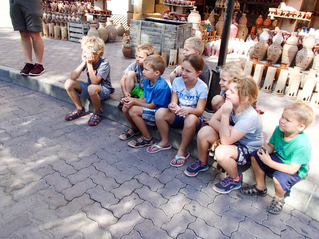 The kids gathered in a shady spot in the Nizwa Souq.